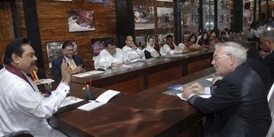 In this handout photograph provided by Sri Lankan President's office, Sri Lankan President Mahinda Rajapaksa, left, talks with U.N. Undersecretary General for Political Affairs B. Lynn Pascoe, right, during their meeting in Colombo, Sri Lanka, Friday, Sept. 18, 2009