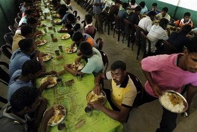 Former Sri Lankan militants share a meal at a rehabilitation centre in Welikanda, in eastern Sri Lanka