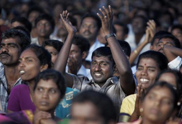 AP Internally displaced Sri Lankan Tamils react as they hear the announcement of the opening of all camps for the displaced in Vavuniya, Sri Lanka, on Saturday.