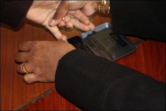 Application of indelible ink to prevent duplication