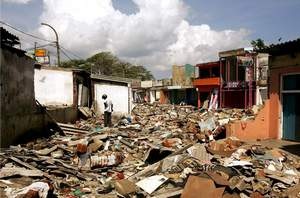  A man wandering around the rubble in the commercial centre of the town of Galle, southern Sri Lanka, a month after it was flattened by the Boxing Day 2004 tsunami Desmond Boylan / Reuters