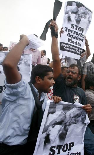 Angry voices: Media activists protesting the killing of Lasantha Wickramatunga. Photo: AP