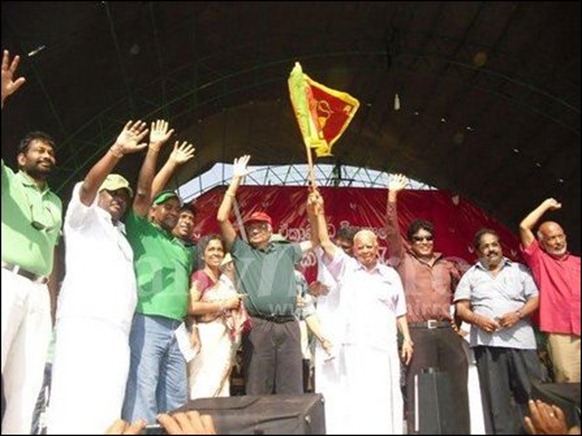 The photo of Sampanthan and Ranil holding the Lion flag highlighted in the Colombo media [Photo courtesy: Daily Mirror]