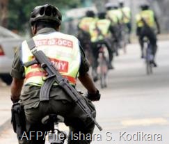 Sri Lankan security force personnel patrol on bicycles in Colombo on January 26, 2009 (AFP/File, Ishara S. Kodikara)