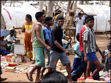 Shops and stalls run by refugees line the straight roads of Menik Farm