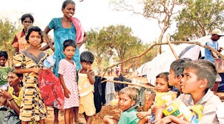 Children at an IDP camp . Inset: A general view of a camp