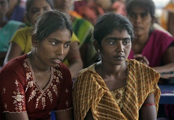 In this photo taken Nov. 11, 2009, Sri Lankan ethnic Tamil women are interviewed for employment at Brandix garment factory in Punani, about 200 kilometers (124 miles) northeast of Colombo, Sri Lanka. Brandix, Sri Lanka's largest garment manufacturer was the first to open a garment factory in the East after hostilities ended. (AP Photo/Eranga Jayawardena)