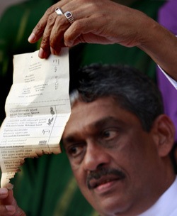 Sri Lanka's losing presidential candidate, former Gen. Sarath Fonseka, the man who defeated the Tamils, says the vote was rigged. He is shown here in early February 2010, just days before his arrest.  reuters