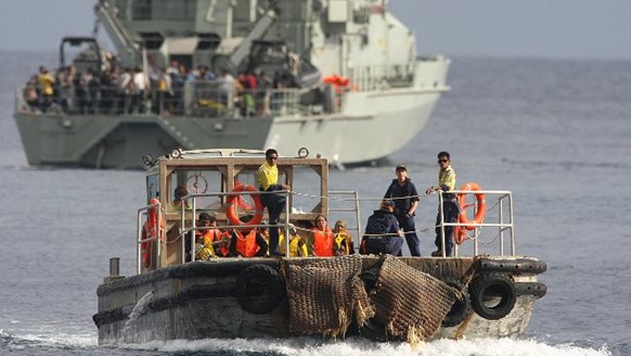  Asylum seekers on a barge from HMAS Wollongong to go to Christmas Island. Picture: Colin Murty  Source: Herald Sun 