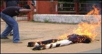 An effigy of Rajapaksa being burnt by Tamil activists