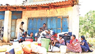 Families at makeshift shelters in Dharmapuram. 