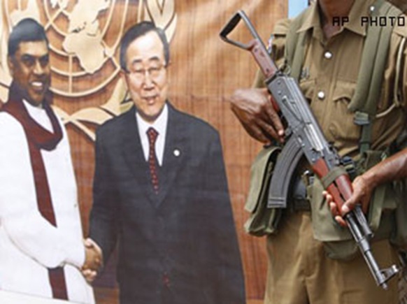 Sri Lanka's banner of UN Ban, with gun, Vavuniya camps