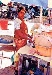 Trade hope: A woman sells peanuts in Murikandi