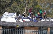 Asylum-seekers have protested from the roof of a Sydney immigration centre for a second day