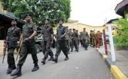 Sri Lankan soldiers patrol outside Colombo's main jail following a drug raid