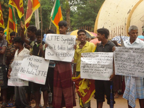 The army liberated the country, saving the human rights of Tamils. Diaspora Tamils and organisations blaming the army should be sent out, reads one placard in Tamil. The other one in Tamil says while the diaspora was free, we suffered in the hands of the terrorists. Now the diaspora should help the development that takes place here. 
