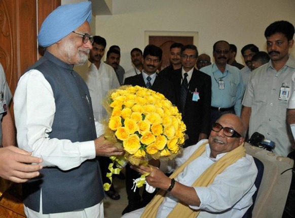 PTI Tamil Nadu Chief Minister M Karunanidhi presents a bouquet to Prime Minister Manmohan Singh during a meeting at Raj Bhavan in Chennai. A PTI file photo. 