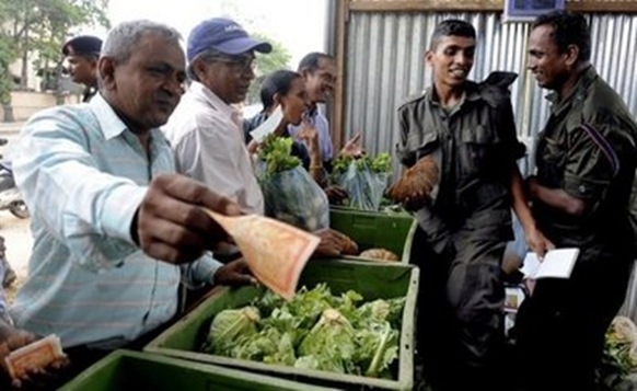  AFP – Sri Lankan soldiers sell vegetables in Colombo on January 7. Sri Lanka's army opened a chain of food … 