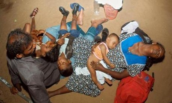 File photo shows a Sri Lankan refugee family resting at the Mandapam refugee camp, about 620 km (385 miles) from the southern Indian city of Chennai in 2006. REUTERS/Babu