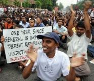 Sri Lankan opposition activists stage a protest outside a jail in Colombo