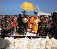 Occupying Sinhala military receiving the sapling and the monks came in a special flight to Jaffna