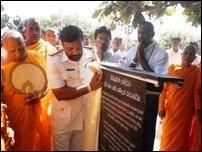 A military official unveiling the Sinhala version of the ‘Rajapaksa inscription’