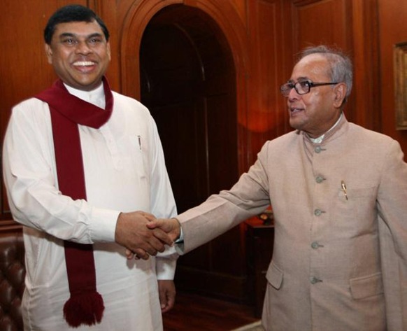 PTI After his 2008 visit to New Delhi, senior Sri Lankan presidential adviser Basil Rajapaksa, seen here with External Affairs Minister Pranab Mukherjee, told the Americans that India had taken up the devolution issue with him, but that the focus was more about resolving fishermen’s problems. 