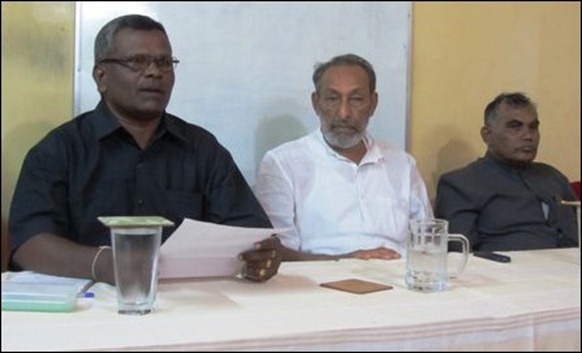 Vasudeva Nanayakara [middle] addressing press in Jaffna 