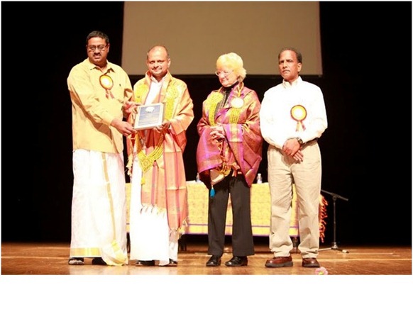     Rudrakumaran and Karan Parker being honored 