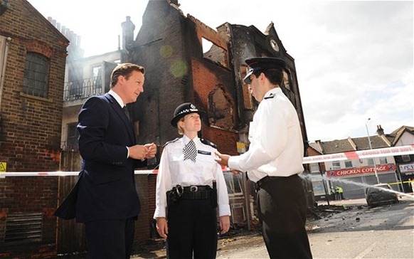 Prime Minister Cameron in Croydon, speaking to police commanders before visiting shops on London road