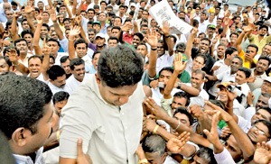 Sajith Premadasa co-deputy leader of UNP surrounded by the crowd at the UNP rally held at the Town Hall in Colombo on Thursday Pic by Gemunu Wellage