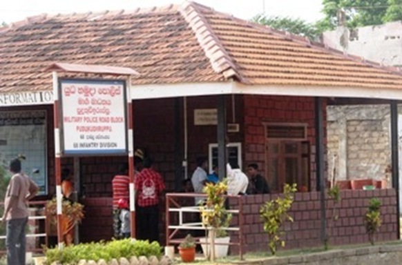 A Sri Lankan defence outpost in Puthukudyiruppu with name board in Sinhalese and English