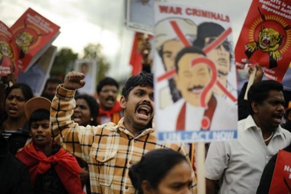 A Tamil activist reacts during a demonstration at the UN's European headquarters in Geneva (AFP, Fabrice Coffrini)