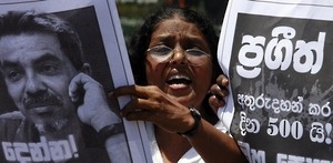 A member of the Free Media Association shouts slogans in front of an image of missing cartoonist and columnist Prageeth Eknaligoda during a protest in Colombo June 8, 2011. The protest was held to mark 500 days since the disappearance of Eknaligoda, a pro-opposition journalist who worked for Lanka-e-News, a private-owned independent website that was critical of the government. The placard reads "500 days since Prageeth's disappearance."