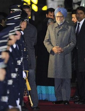 AP Prime Minister Manmohan Singh walks down the red carpet on his arrival at the airbase in Seoul on Saturday. He will take part in the nuclear security summit,to be held on March 26 and 27, to discuss ways of protecting nuclear materials and facilities. 