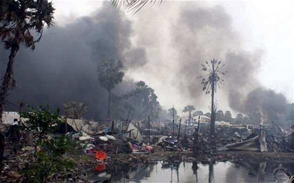 Sri Lanka’s Killing Fields: smoke billows from a civilian no-fire zone shelled in 2009. Photo: EPA