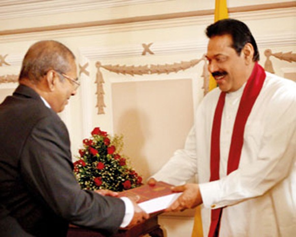 LLRC Chairman C.R. de Silva presenting the LLRC report to President Rajapaksa in December last year