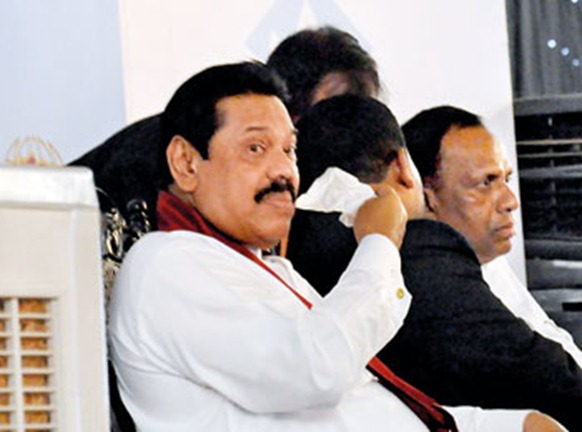 President Mahinda Rajapaksa feeling the heat at Expo 2012 held at the BMICH. Pic by Susantha Liyanawatte