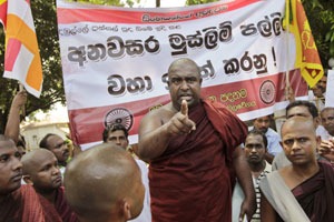 A Sri Lankan Buddhist monk gestures as he speaks to a gathering during a protest in Kalutara, south of Colombo. (AP)