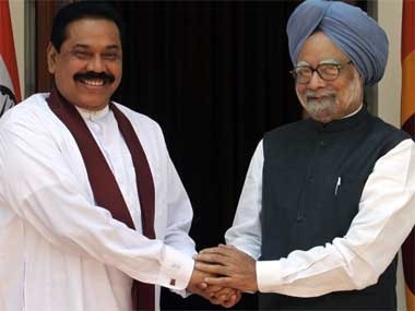 Rajapkse with Indian PM Manmohan Singh. Reuters