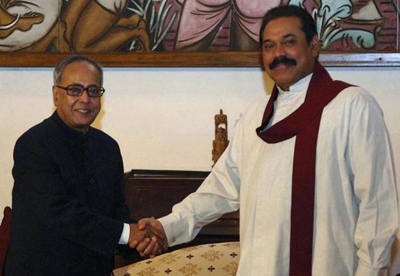 AP Sri Lankan President Mahinda Rajapaksa shakes hands with Pranab Mukherjee. File photo. 