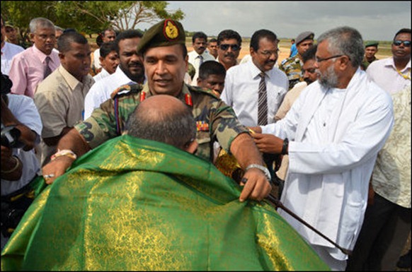 Jaffna commander of the occupying genocidal military, trailed behind by the SL minister and paramilitary leader Douglas Devananda, receives parliamentarians of the Commonwealth that once faught against the apartheid of South Africa. [Photo courtesy: Sri Lanka Army in Jaffna]