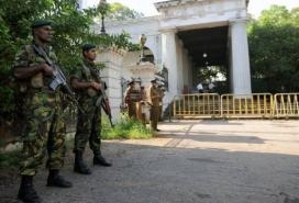 Sri Lankan Special Task Force (STF) soldiers stand guard outside the Colombo High Court in Colombo in 2011 (AFP/File, Ishara S.Kodikara)