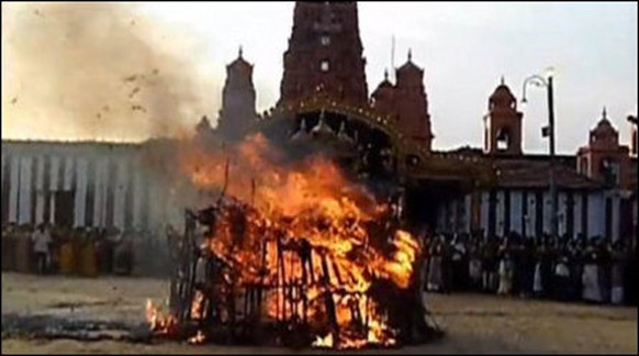 The Kaarthikai flame, called Chokkap-panai in Eezham Tamil, lighted in front of the Nalloor temple in 2011. It is called Chokkap-panai because of the use of dried palmyra palm leaves in making the flame. 