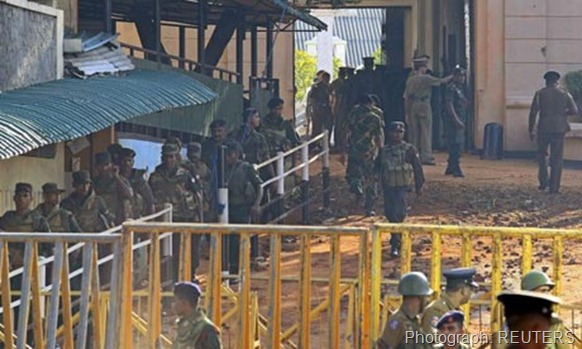 Army soldiers leave Welikada prison after clash between the Special Task Force and prisoners in Colombo Photograph: REUTERS