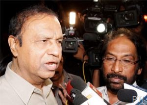 DMK leader T R Baalu (L) talks to media outside Rashtrapati Bhavan in New Delhi on Tuesday night after submitting a letter to President Pranab Mukherjee to withdraw the support to the UPA government. (PTI Photo)