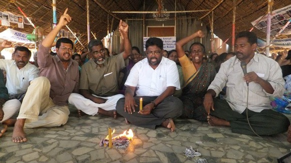 Activists at Idinthakarai burning the copies of the draft proposal tabled by the USA at the UNHRC at a recent protest