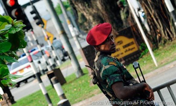 A Sri Lankan soldier on guard in the capital, Colombo, where the case of Khuram Shaikh's murder has been transferred. Photograph: Sanka Vidanagama/AFP/Getty Images