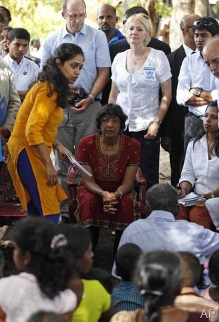 AP - U.N. High Commissioner for Human Rights Navi Pillay listens to ethnic Tamil war survivors during her visit to Mullivaikkal, Sri Lanka, on Tuesday. 