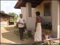 Selvarajah Kajendren talking to a neighbour of Jeyakumari at Tharumapuram, Ki'linochchi